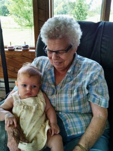 Great-grandma with a calm baby.